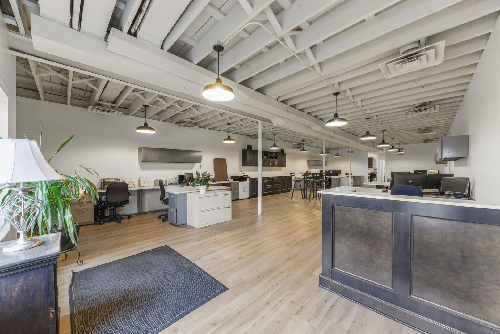 175 North Washington Street Wheaton, IL 60187 - Photo 3 of 14 a large white kitchen with lots of counter space and windows