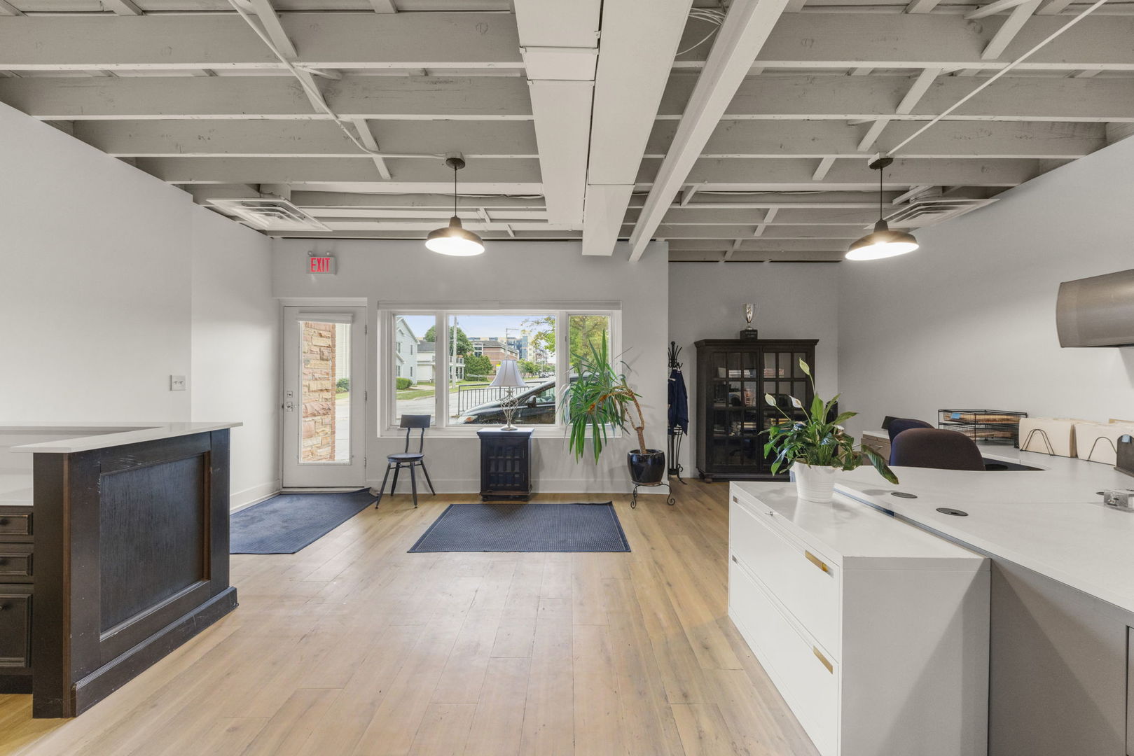 175 North Washington Street Wheaton, IL 60187 - Photo 4 of 14 a living room with stainless steel appliances furniture a fireplace a flat screen tv and a floor to ceiling window