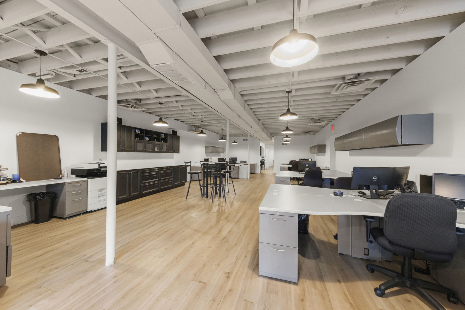 175 North Washington Street Wheaton, IL 60187 - Photo 5 of 14 a room with stainless steel appliances lots of wooden furniture a chandelier