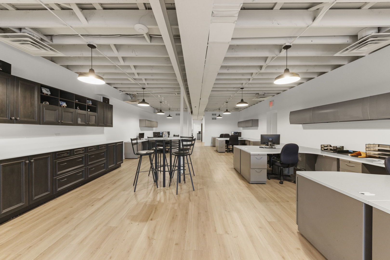 175 North Washington Street Wheaton, IL 60187 - Photo 6 of 14 a kitchen with stainless steel appliances wooden floors stove and cabinets