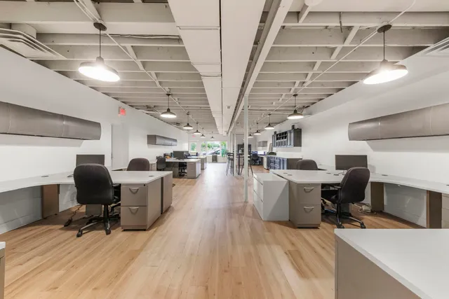 a living room with lots of furniture and white walls