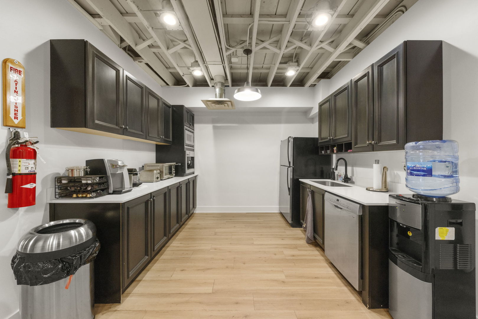 175 North Washington Street Wheaton, IL 60187 - Photo 10 of 14 a kitchen with stainless steel appliances granite countertop a stove and a sink