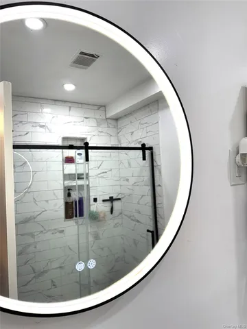 a view of a hallway with a mirror