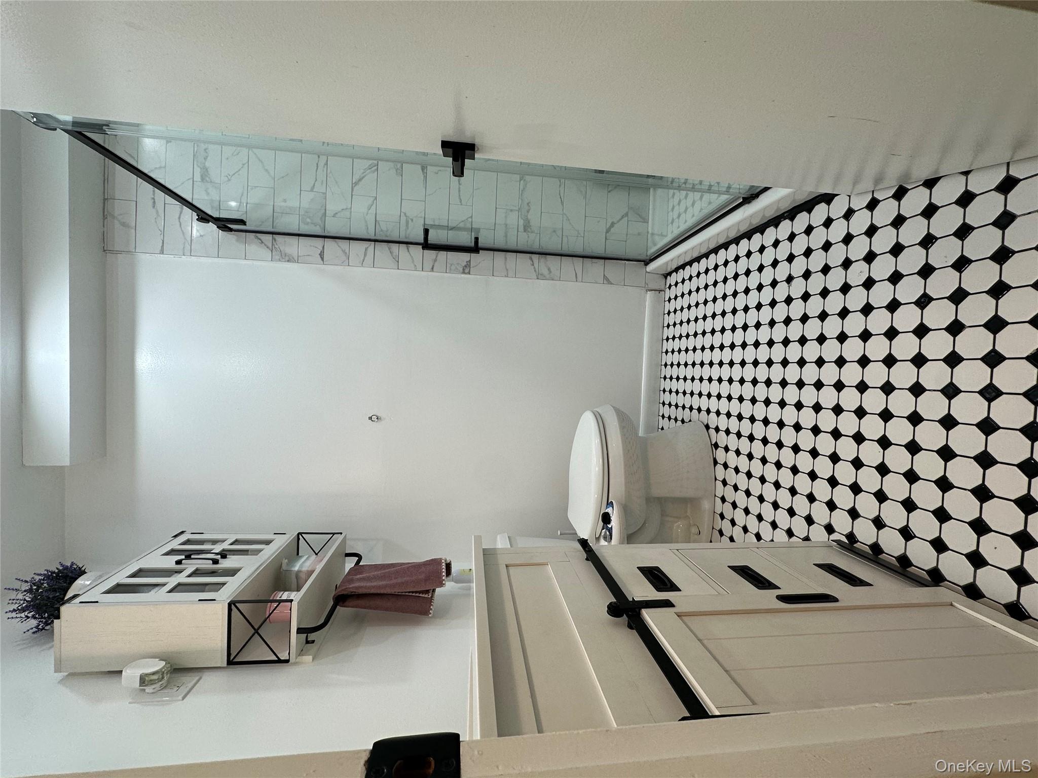 26 Cooper, Unit 510 Poughkeepsie, NY 12603 - Photo 17 of 28 Full bath featuring a shower stall, vanity, and light floors