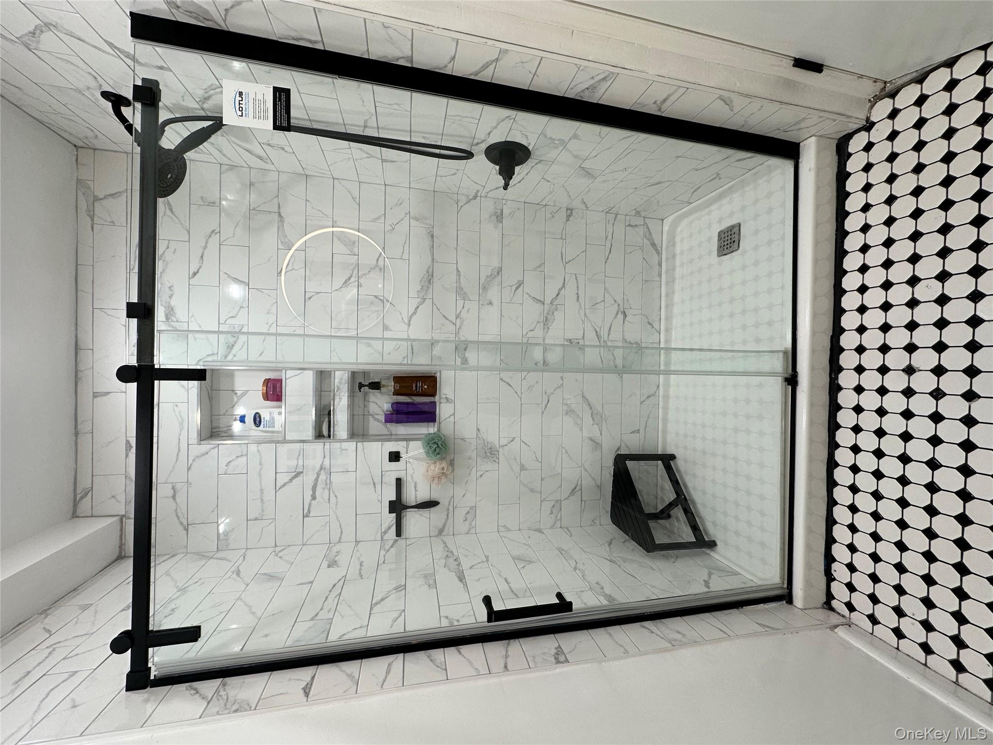 26 Cooper, Unit 510 Poughkeepsie, NY 12603 - Photo 19 of 28 Full bath with tile patterned floors and a stall shower