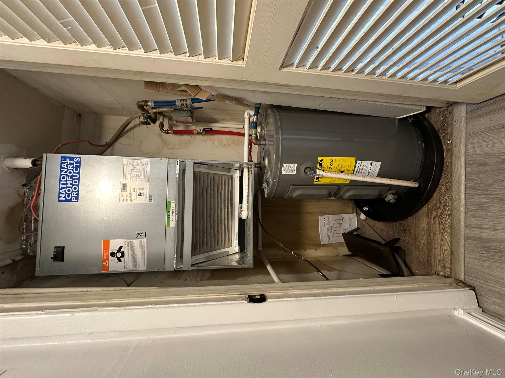 26 Cooper, Unit 510 Poughkeepsie, NY 12603 - Photo 20 of 28 Utility room featuring heating unit and water heater