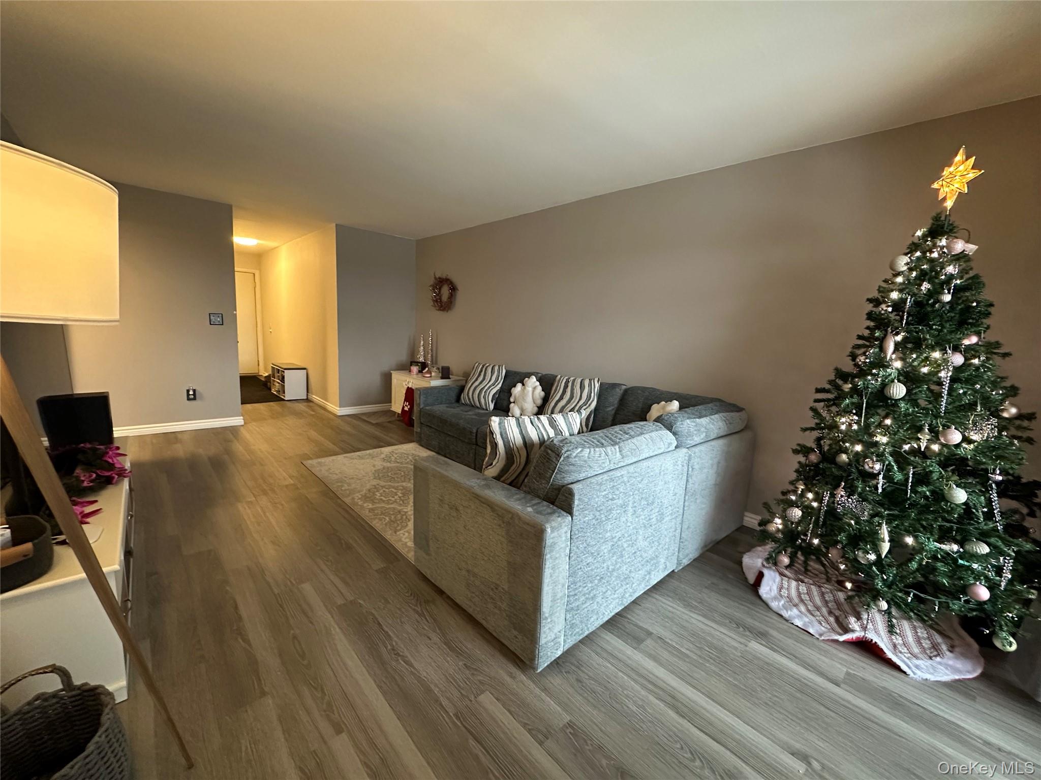 26 Cooper, Unit 510 Poughkeepsie, NY 12603 - Photo 22 of 28 Living area featuring wood finished floors