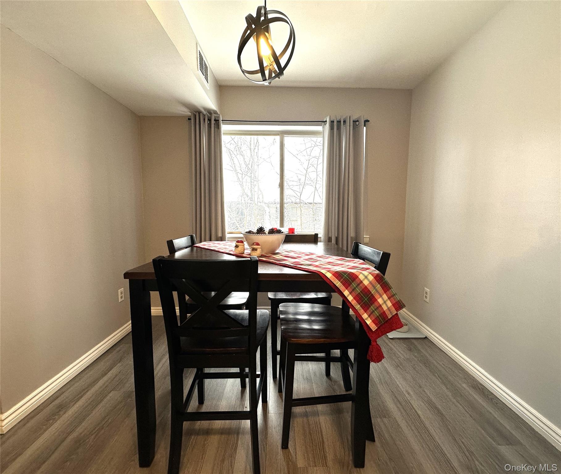 26 Cooper, Unit 510 Poughkeepsie, NY 12603 - Photo 5 of 28 Ding area with new flooring and light fixture