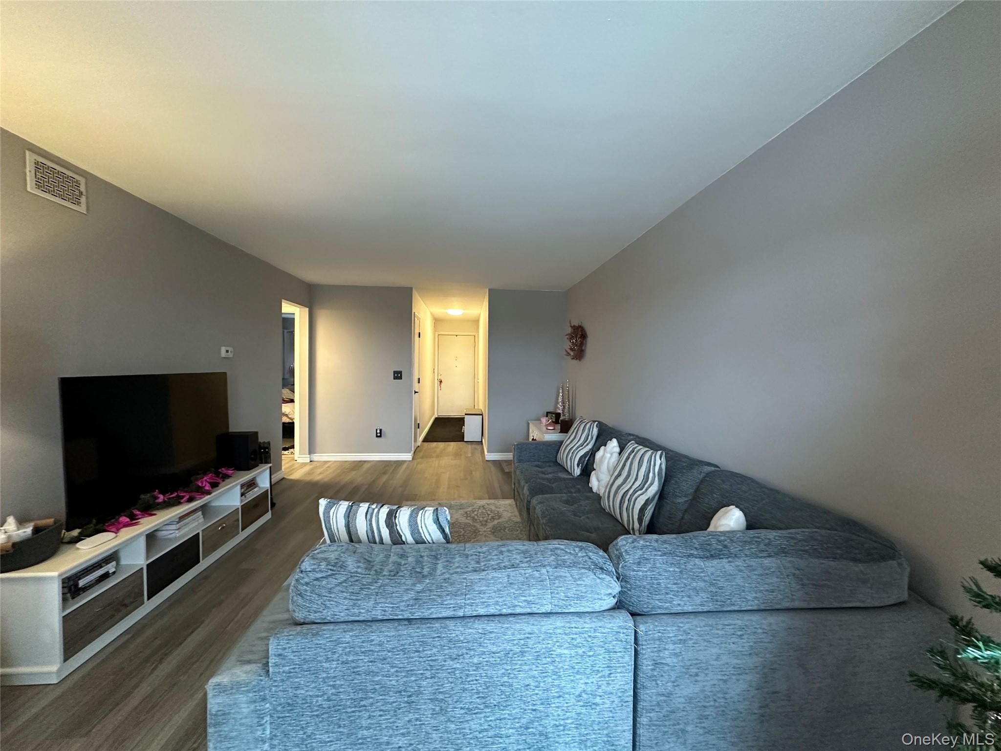 26 Cooper, Unit 510 Poughkeepsie, NY 12603 - Photo 9 of 28 Living area with wood finished floors