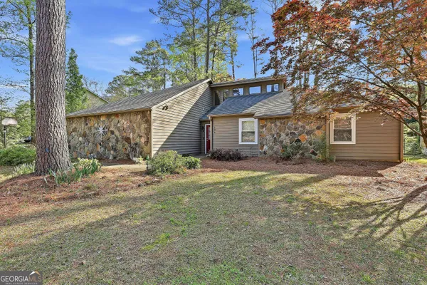 a house with trees in front of it