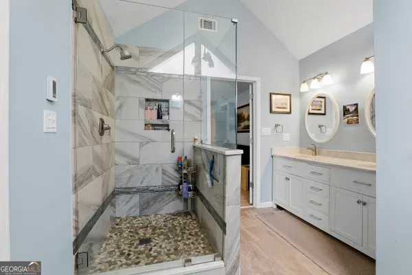 a bathroom with a sink and a mirror