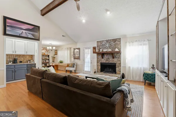 a living room with furniture and a fireplace