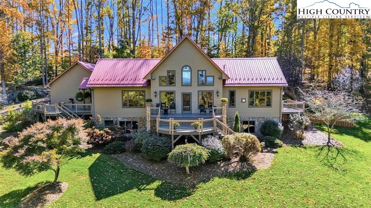 2650 Carson Woods Road Laurel Springs, NC 28644 - Photo 2 of 50 a front view of a house with garden
