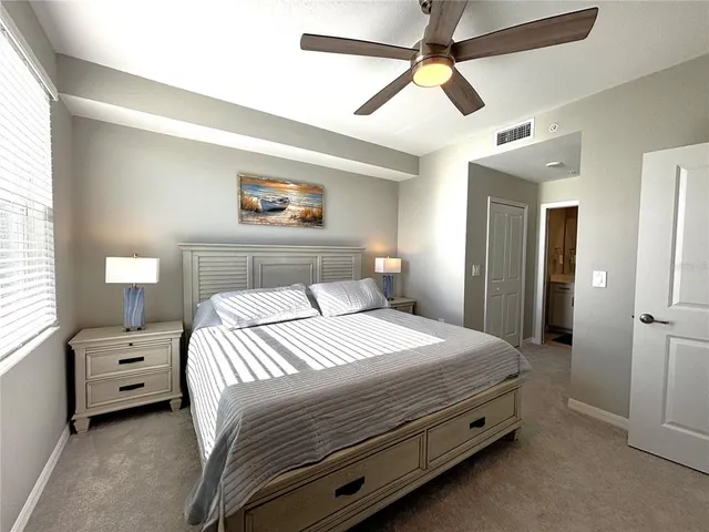 a bedroom with bed and a window