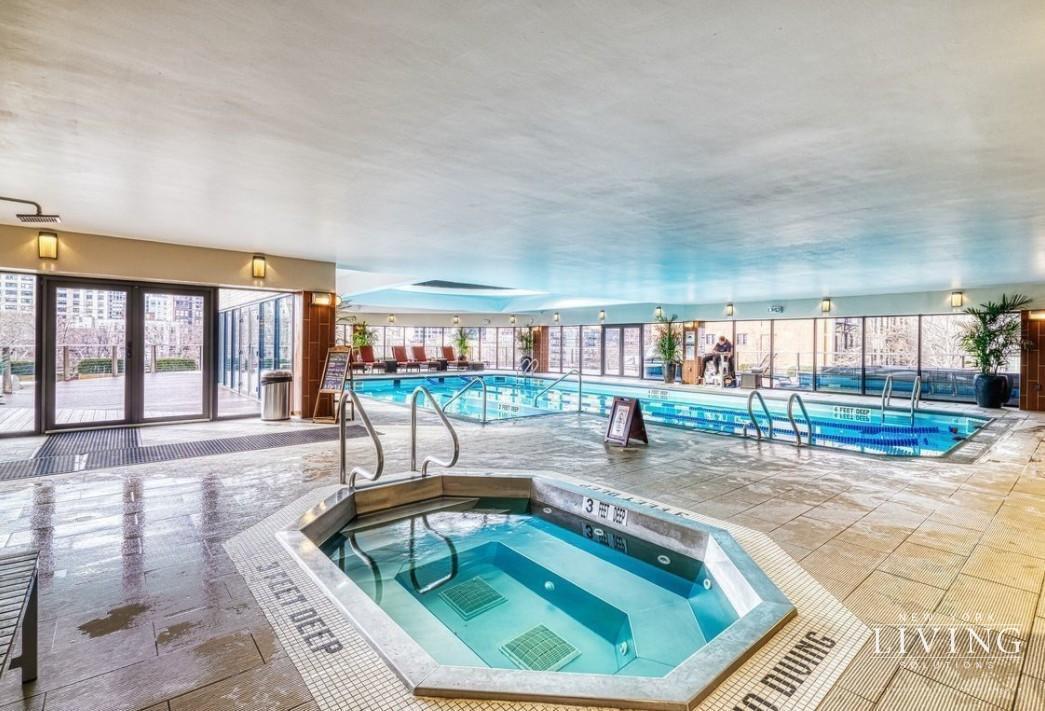 330 East 38th Street, Unit 24A Manhattan, NY 10016 - Photo 14 of 17 a swimming pool with outdoor seating and yard