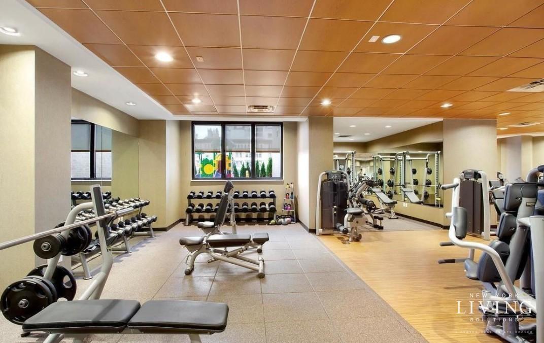 330 East 38th Street, Unit 24A Manhattan, NY 10016 - Photo 15 of 17 a view of a room with gym equipment