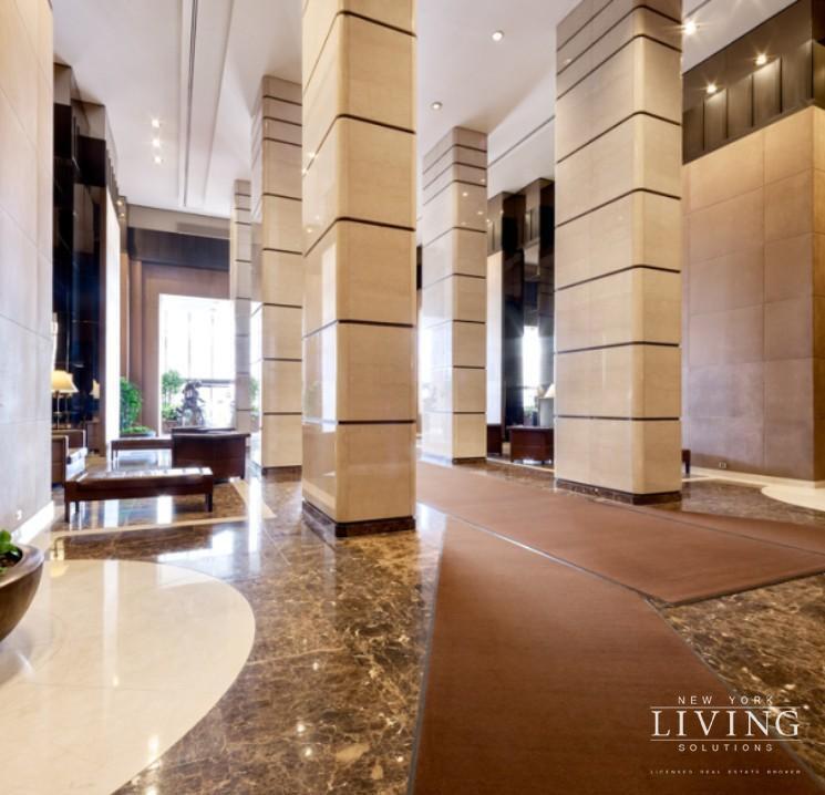 330 East 38th Street, Unit 24A Manhattan, NY 10016 - Photo 17 of 17 a view of a living room with kitchen