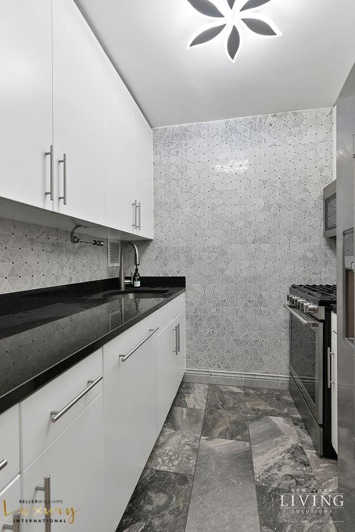 330 East 38th Street, Unit 24A Manhattan, NY 10016 - Photo 7 of 17 a bathroom with a granite countertop sink