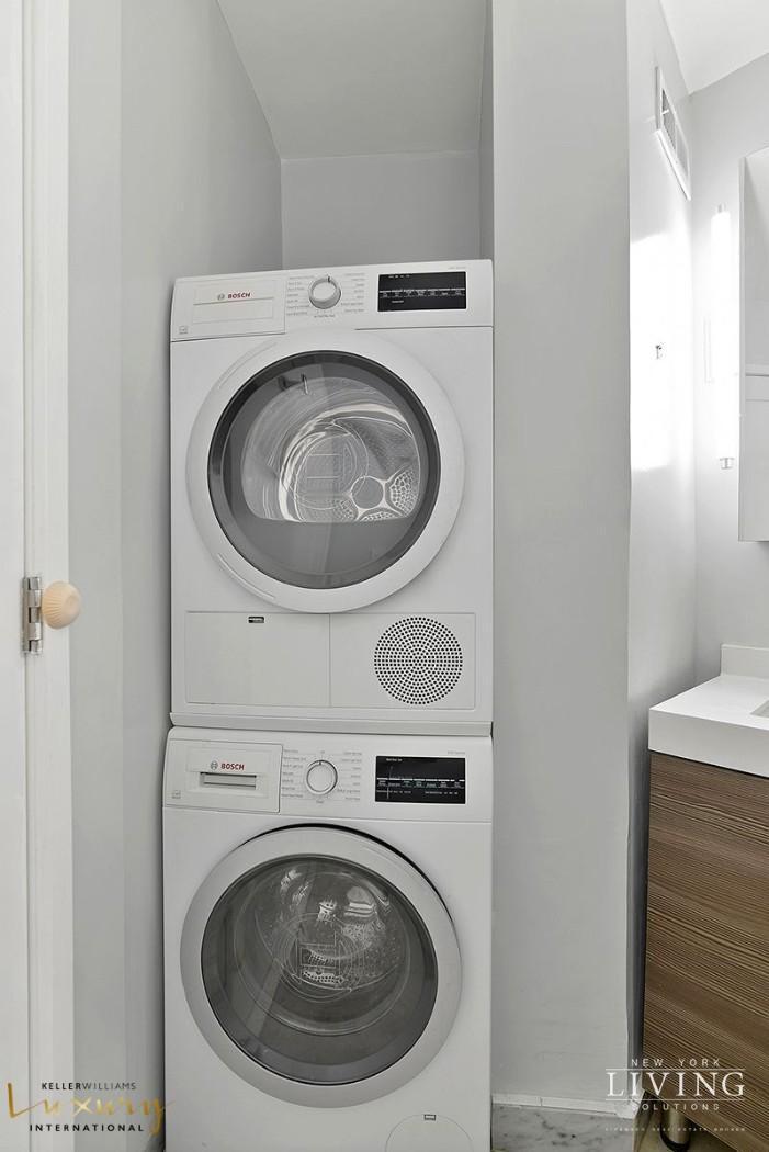 330 East 38th Street, Unit 24A Manhattan, NY 10016 - Photo 9 of 17 a utility room with dryer and washer
