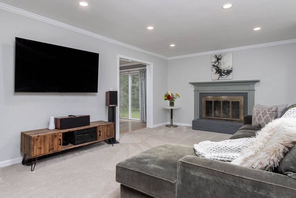 420 Pepperell Road Groton, MA 01450 - Photo 4 of 26 a living room with furniture and a flat screen tv