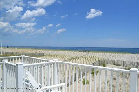 a view of a balcony with wooden floor