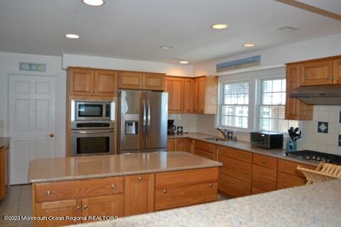 2 Bridge Avenue Bay Head, NJ 08742 - Photo 19 of 24 a kitchen with stainless steel appliances granite countertop a refrigerator and a sink