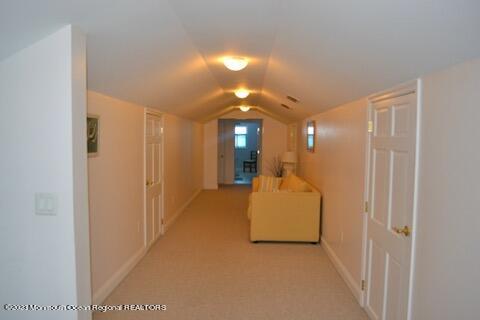 2 Bridge Avenue Bay Head, NJ 08742 - Photo 21 of 24 a view of a hallway with wooden floor and a bathroom