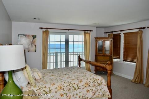 2 Bridge Avenue Bay Head, NJ 08742 - Photo 22 of 24 a bedroom with a bed and a window with balcony view