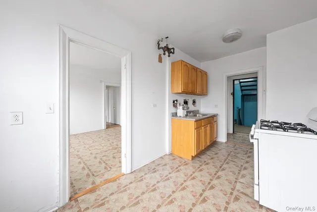 a kitchen that has a sink and a stove