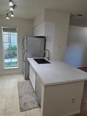 a kitchen with a stove and a microwave