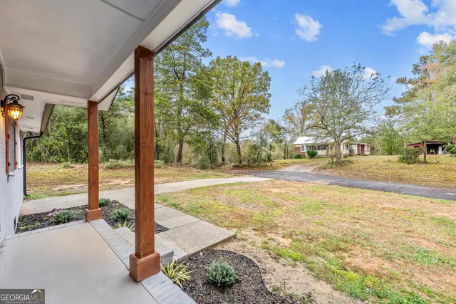 a view of a building with a yard