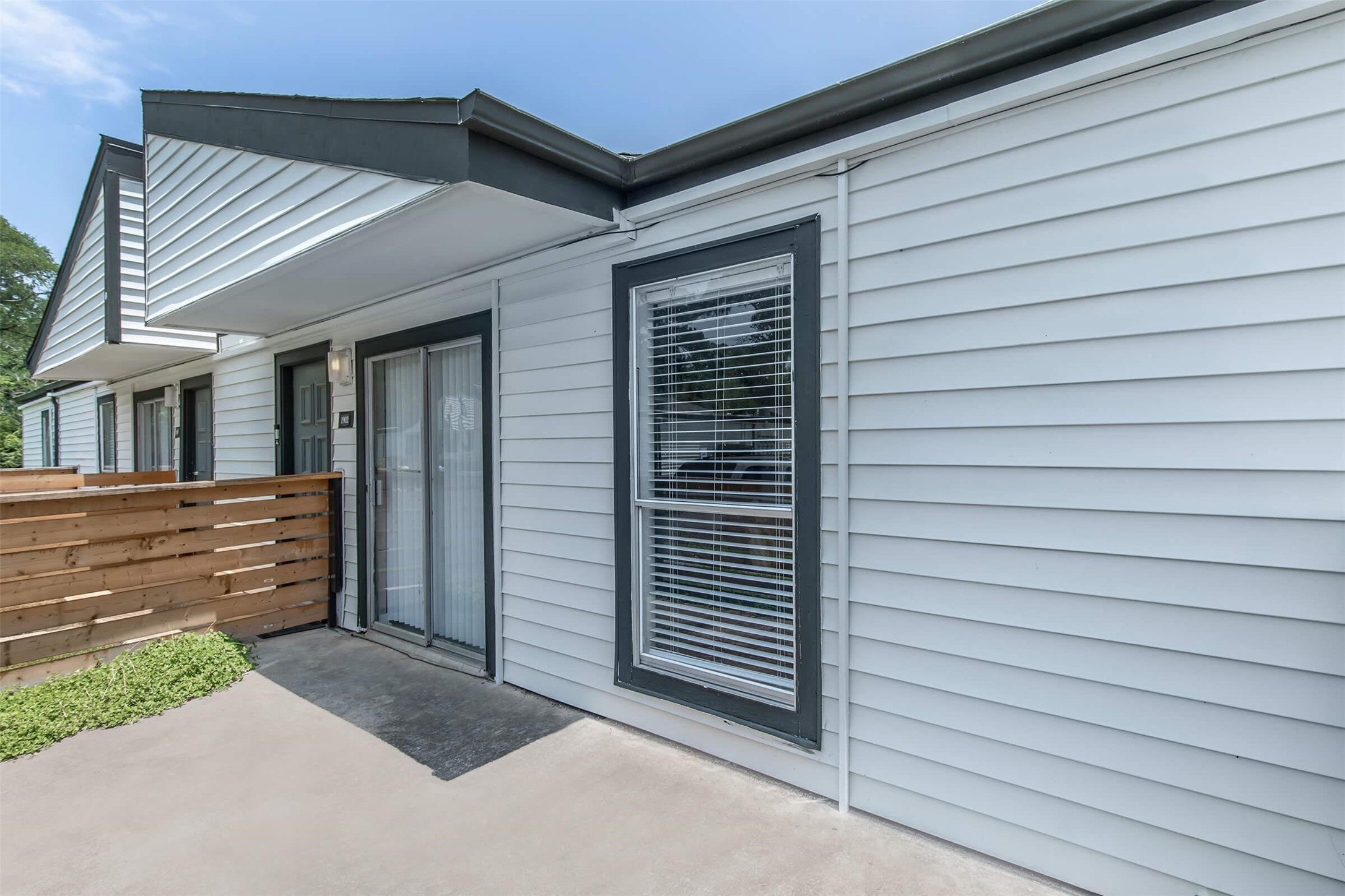 18001 Cypress Trace Road, Unit 1803 Houston, TX 77090 - Photo 17 of 32 a view of a house with a door and wooden walls