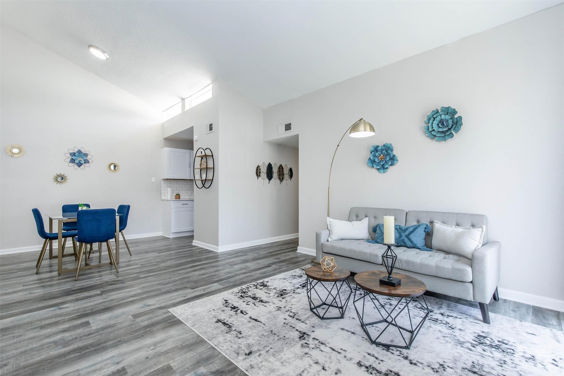 18001 Cypress Trace Road, Unit 1803 Houston, TX 77090 - Photo 4 of 32 a living room with furniture and wooden floor