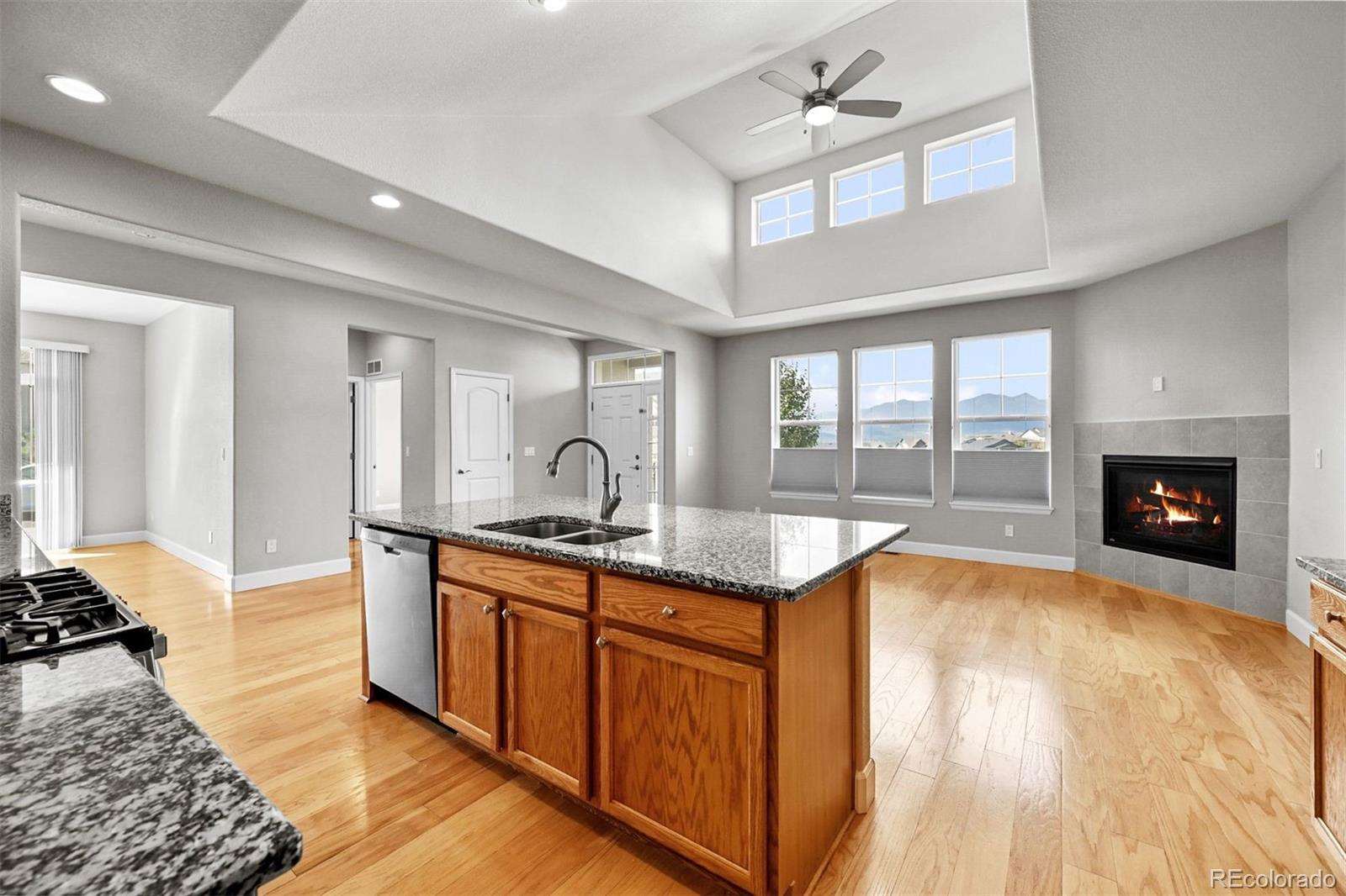 1354 Promontory Bluff View Colorado Springs, CO 80921 - Photo 15 of 45 a kitchen with sink and view of living room