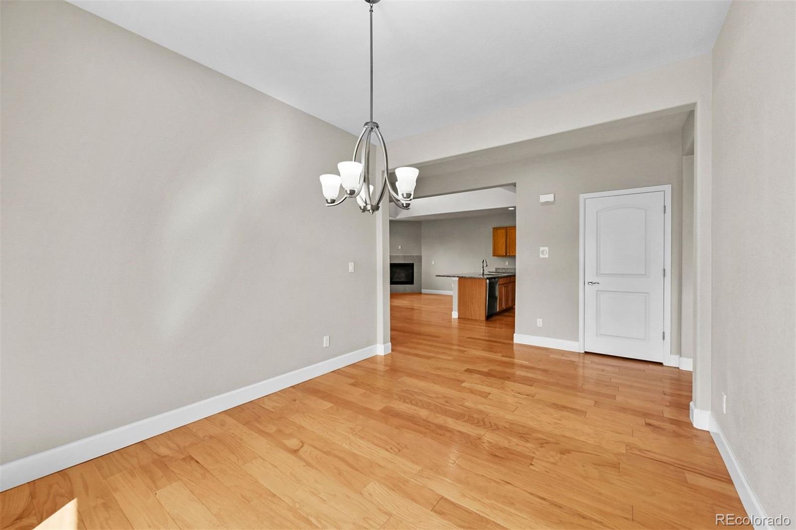 1354 Promontory Bluff View Colorado Springs, CO 80921 - Photo 17 of 45 a view of empty room with wooden floor and fan