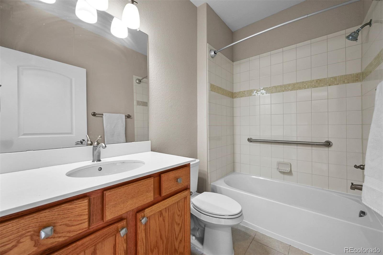 1354 Promontory Bluff View Colorado Springs, CO 80921 - Photo 21 of 45 a bathroom with a sink a toilet and shower