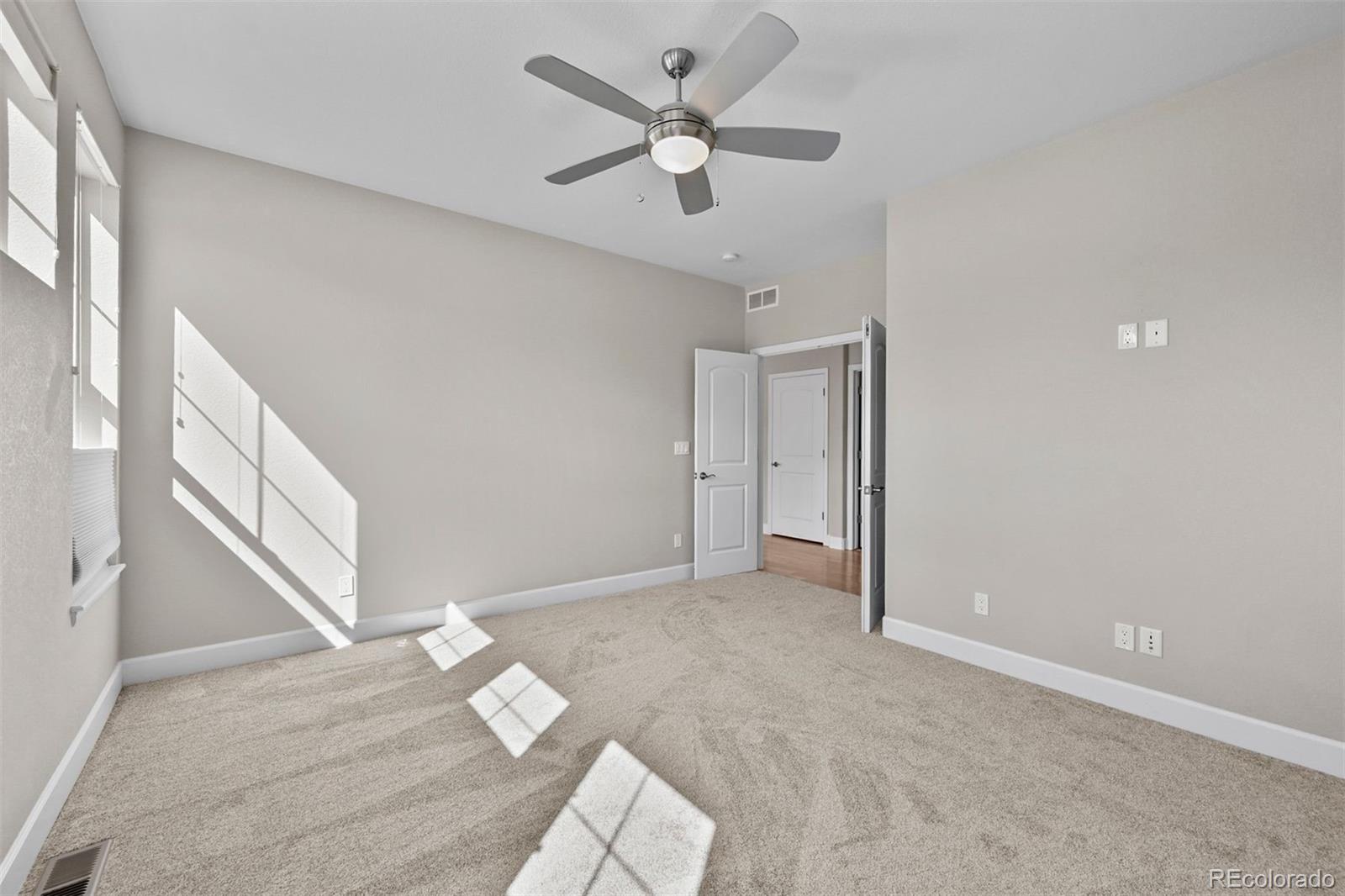 1354 Promontory Bluff View Colorado Springs, CO 80921 - Photo 23 of 45 wooden floor in an empty room with a window