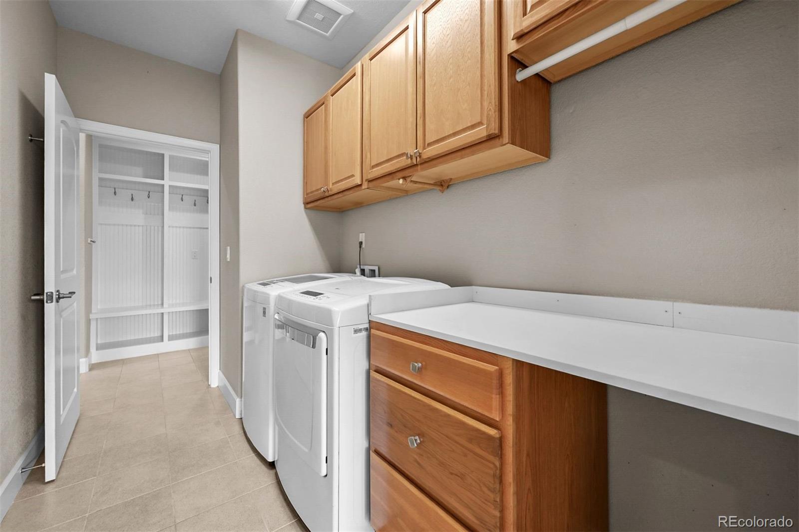 1354 Promontory Bluff View Colorado Springs, CO 80921 - Photo 24 of 45 a utility room with dryer and washer