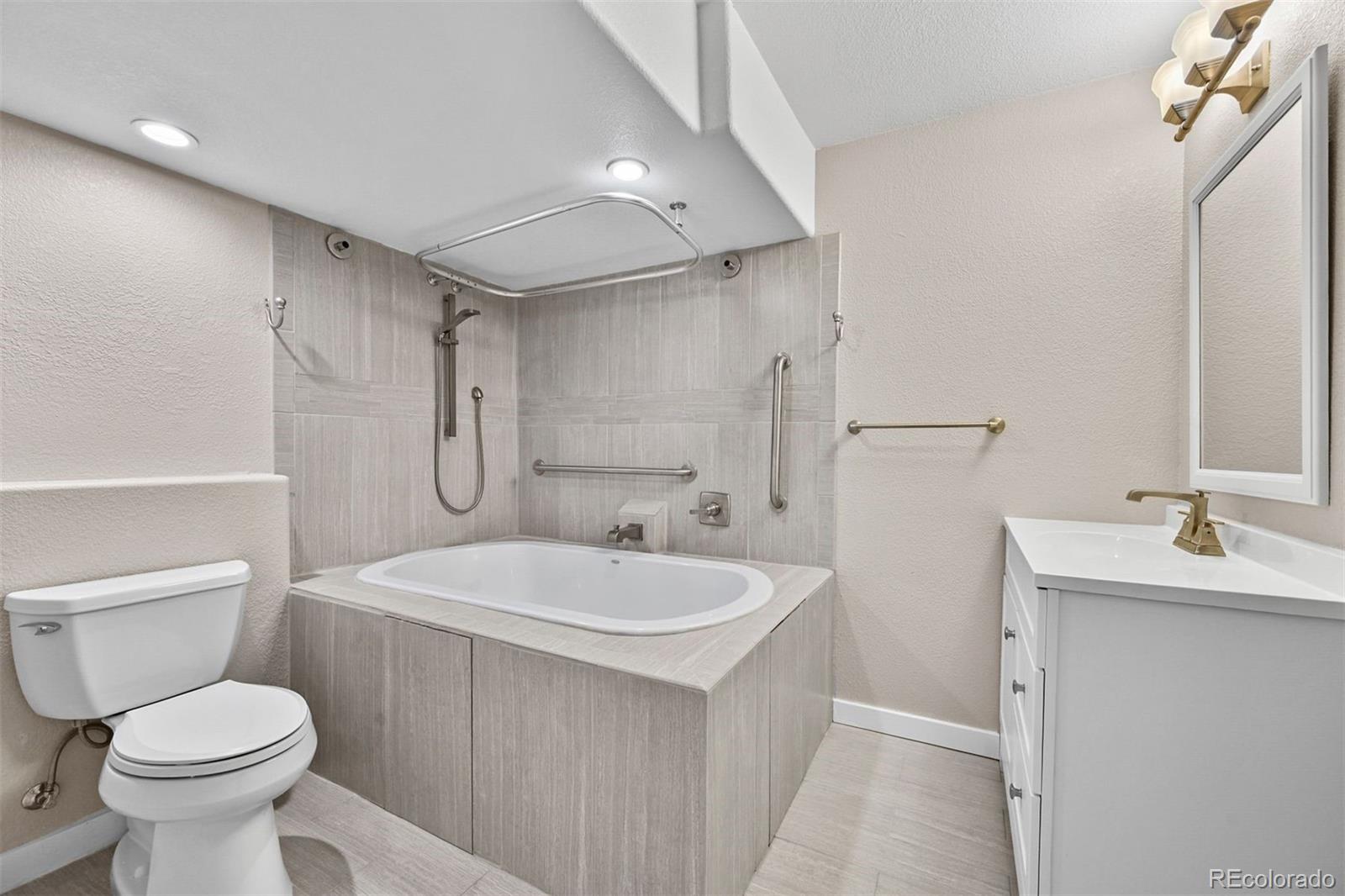 1354 Promontory Bluff View Colorado Springs, CO 80921 - Photo 30 of 45 a bathroom with a sink a toilet and shower