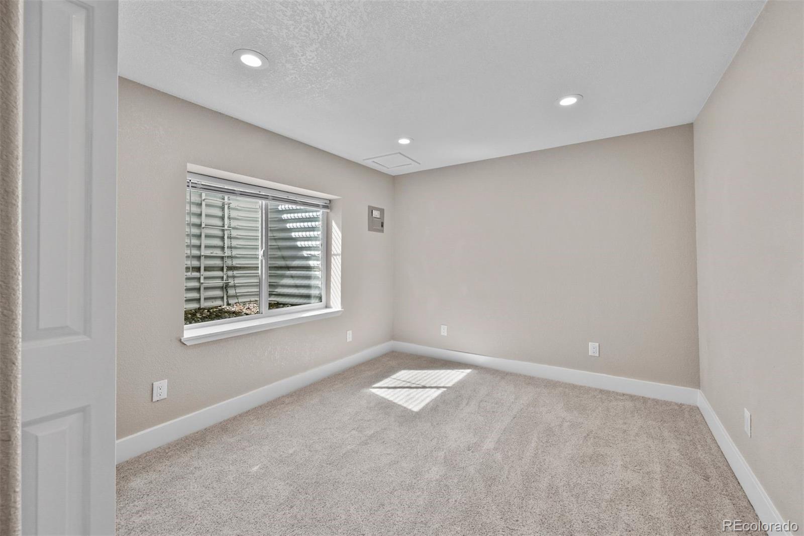 1354 Promontory Bluff View Colorado Springs, CO 80921 - Photo 31 of 45 a view of an empty room with a window