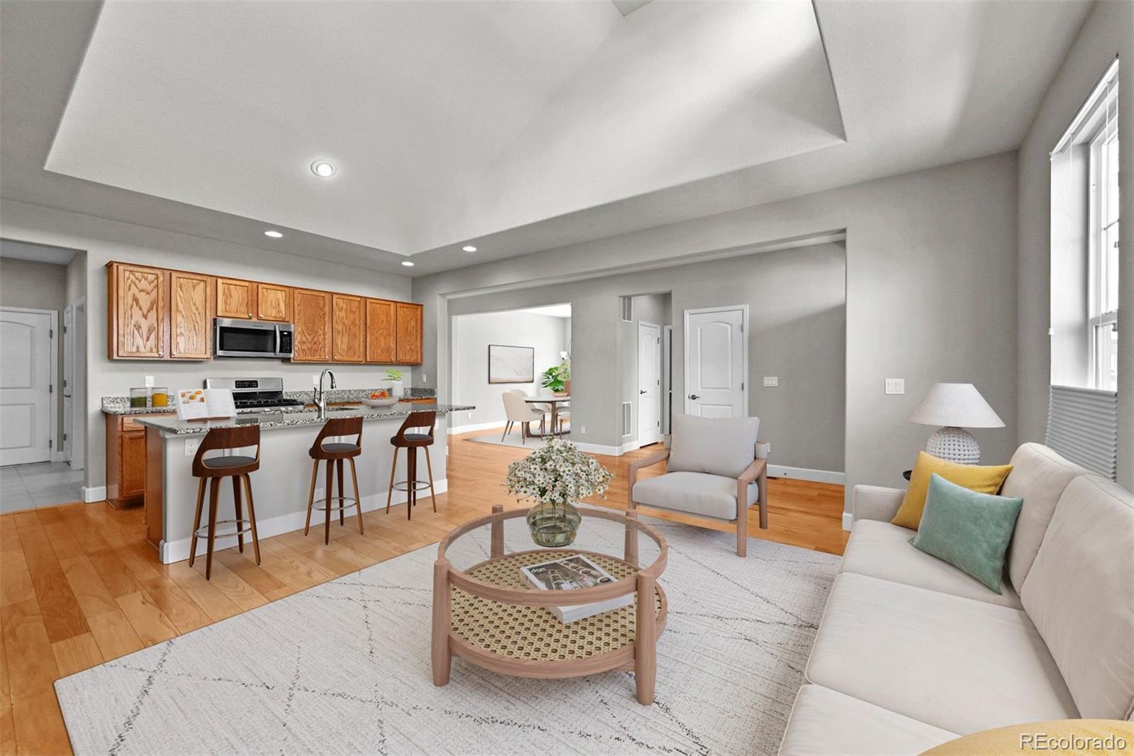 1354 Promontory Bluff View Colorado Springs, CO 80921 - Photo 4 of 45 a living room with furniture kitchen and a table