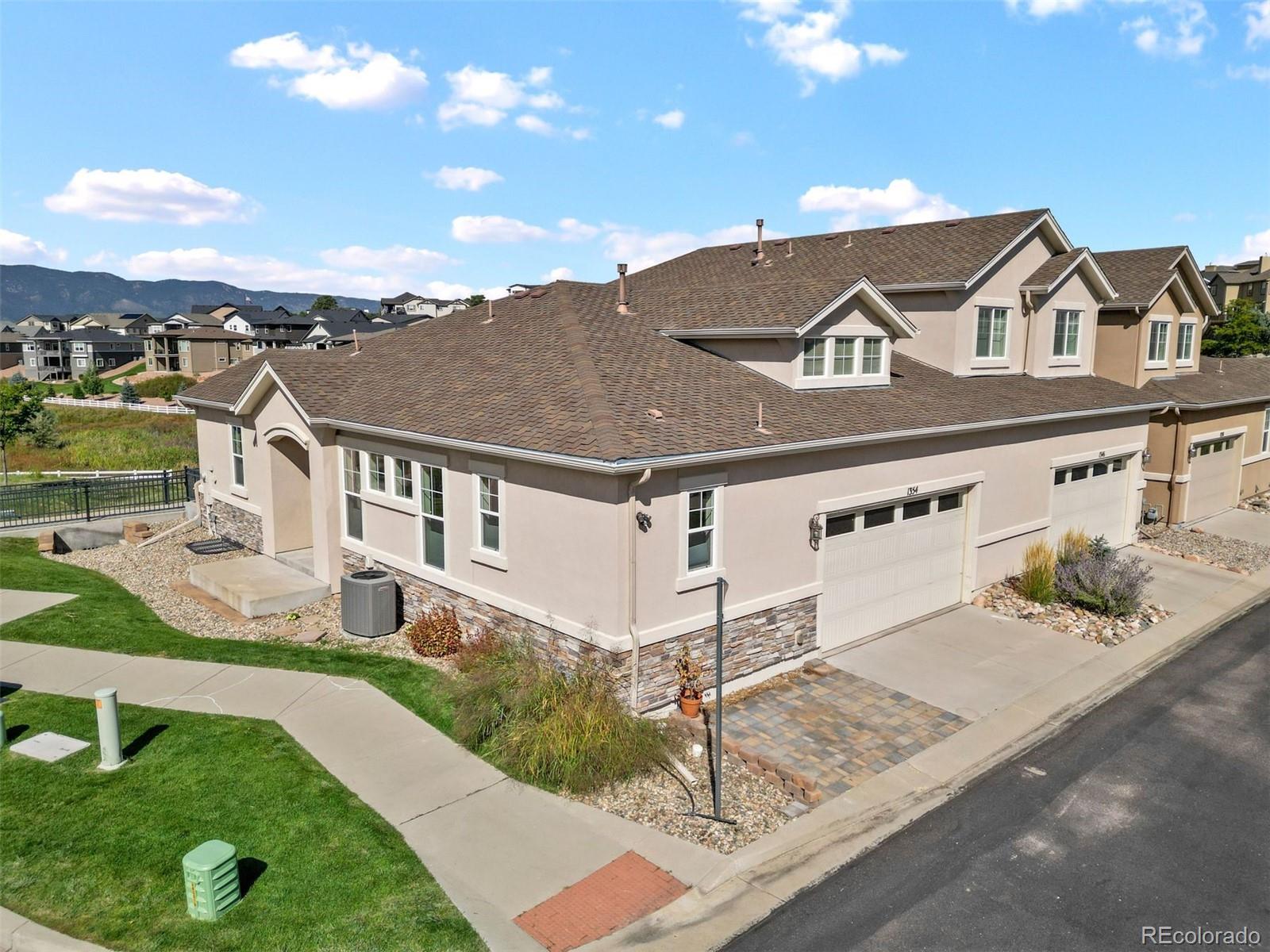 1354 Promontory Bluff View Colorado Springs, CO 80921 - Photo 41 of 45 a front view of a house with garden
