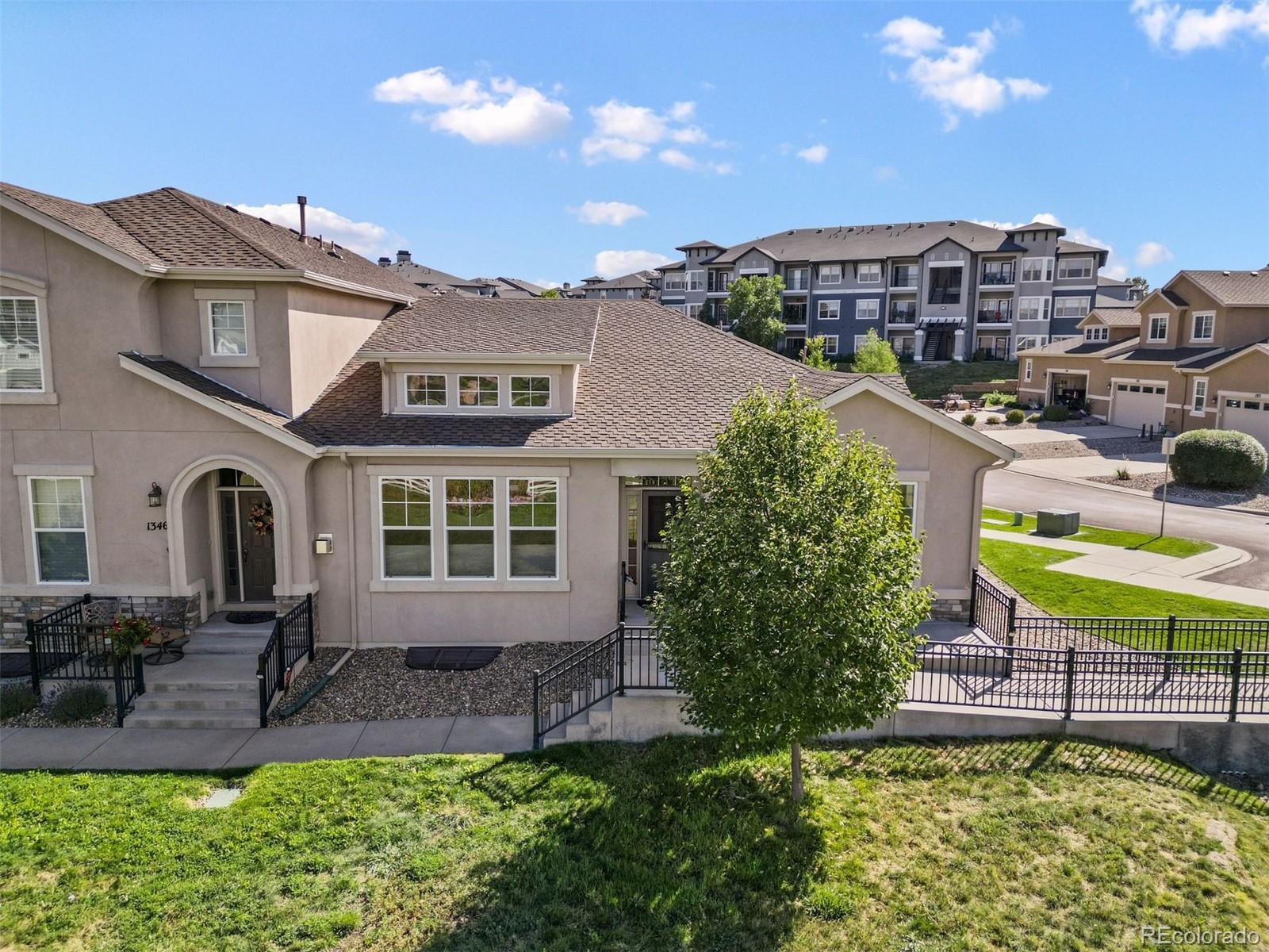 1354 Promontory Bluff View Colorado Springs, CO 80921 - Photo 42 of 45 a front view of a house with garden