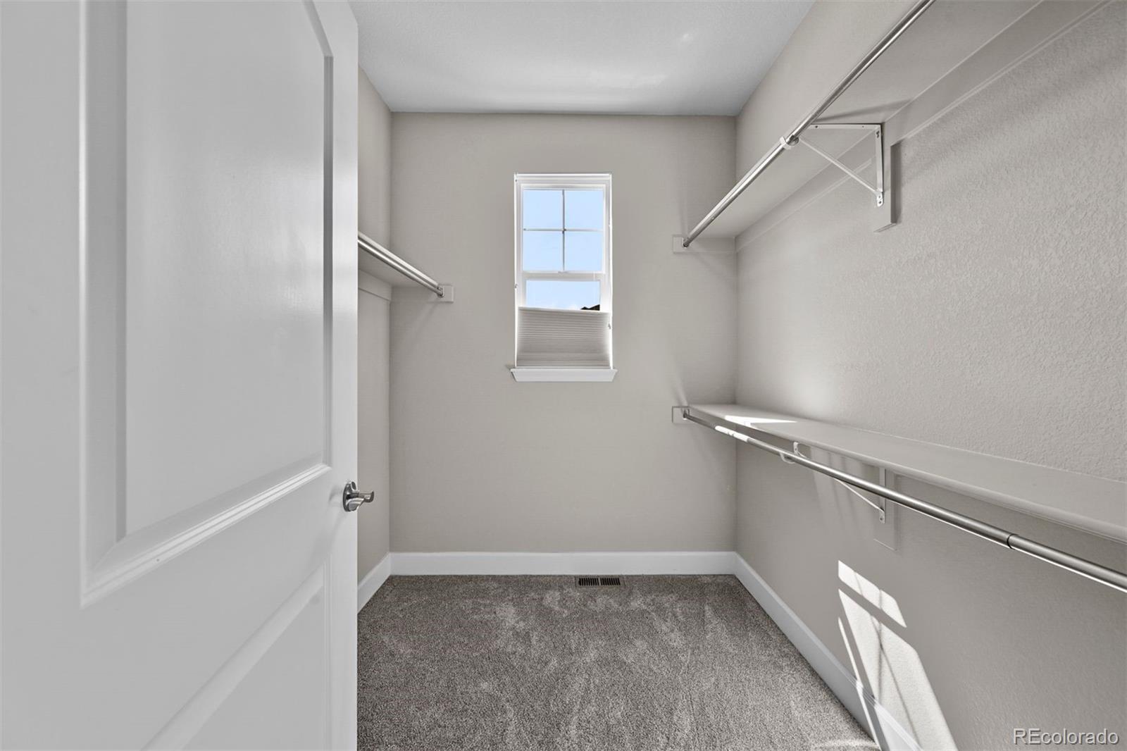 1354 Promontory Bluff View Colorado Springs, CO 80921 - Photo 7 of 45 a view of an empty walk in closet