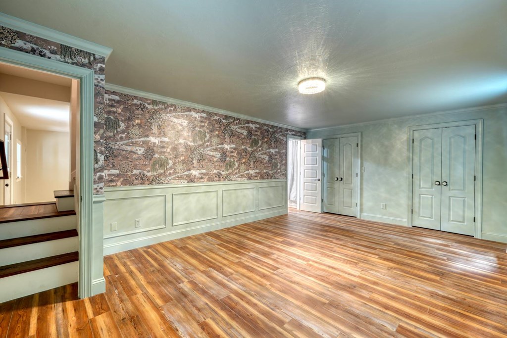 45 Mountain Stream Road Murphy, NC 28906 - Photo 19 of 33 a view of an empty room with wooden floor and a window