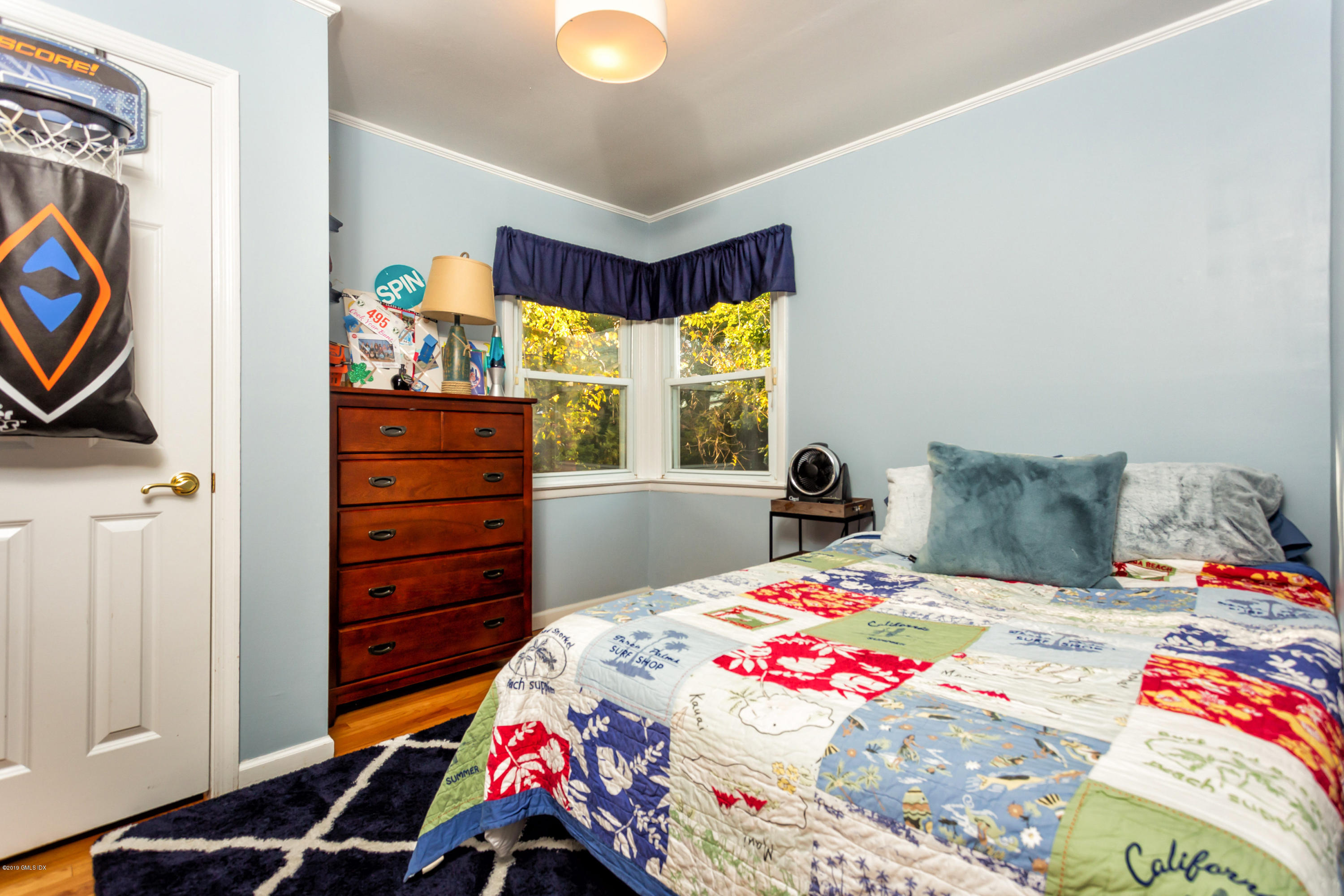 12 Mary Lane Riverside, CT 06878 - Photo 14 of 25 a bedroom with a bed and a window