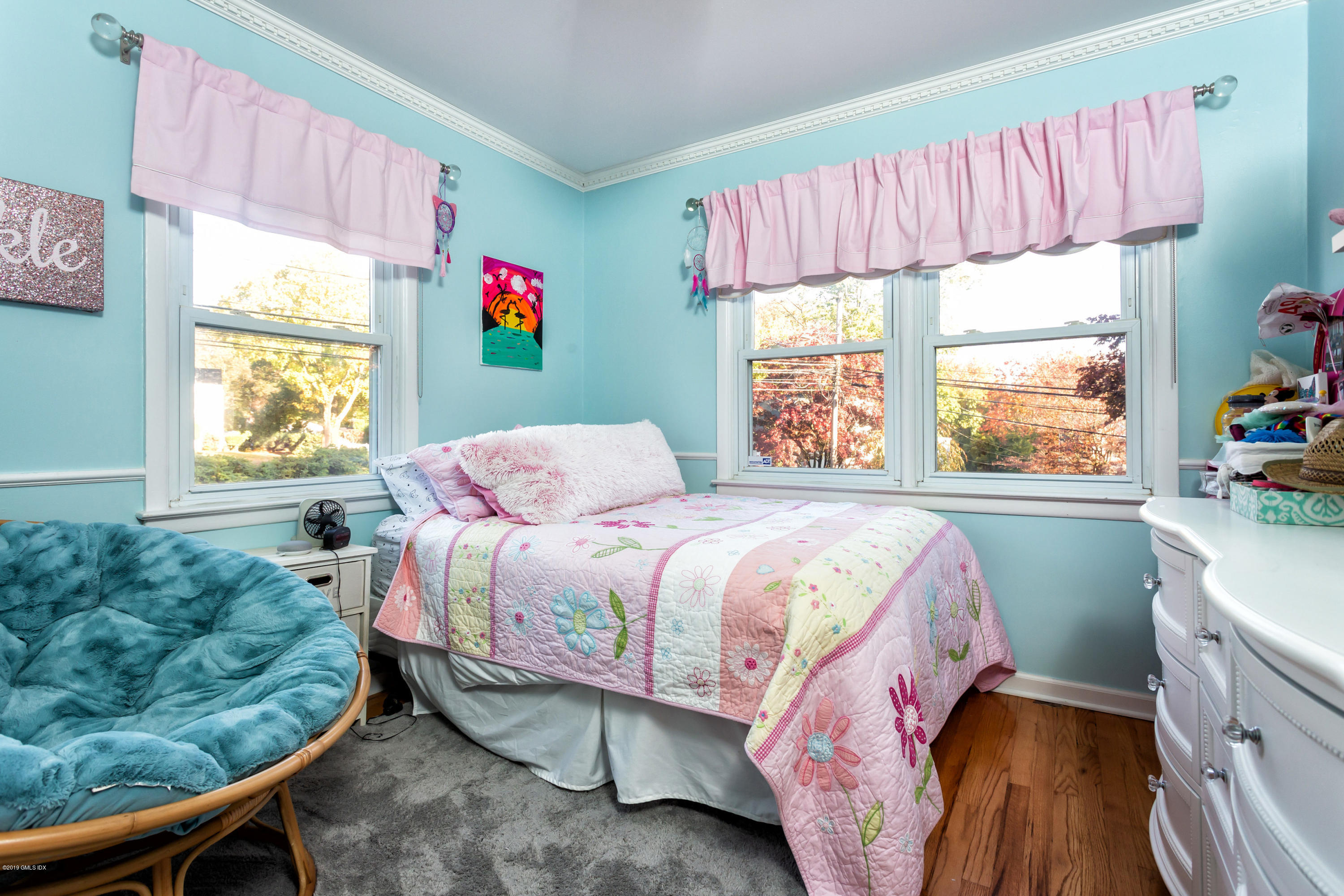 12 Mary Lane Riverside, CT 06878 - Photo 16 of 25 a bedroom with a bed and windows