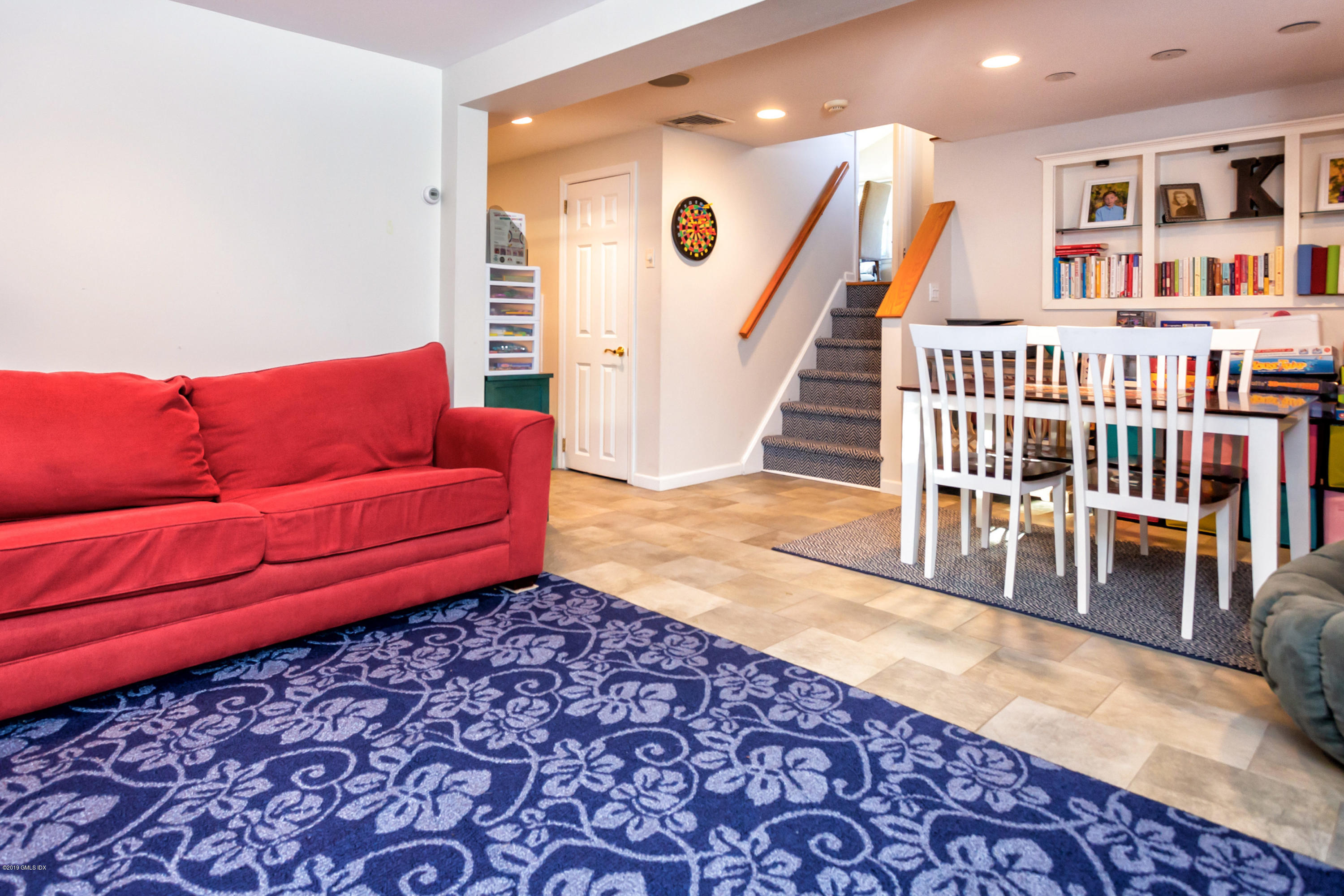 12 Mary Lane Riverside, CT 06878 - Photo 18 of 25 a living room with furniture and a rug