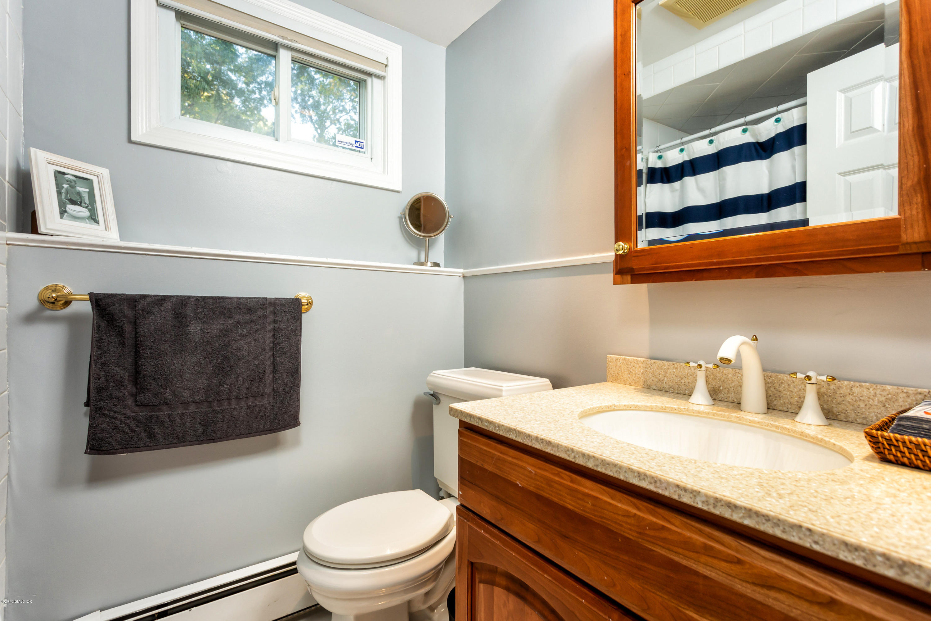 12 Mary Lane Riverside, CT 06878 - Photo 19 of 25 a bathroom with a granite countertop sink and a toilet
