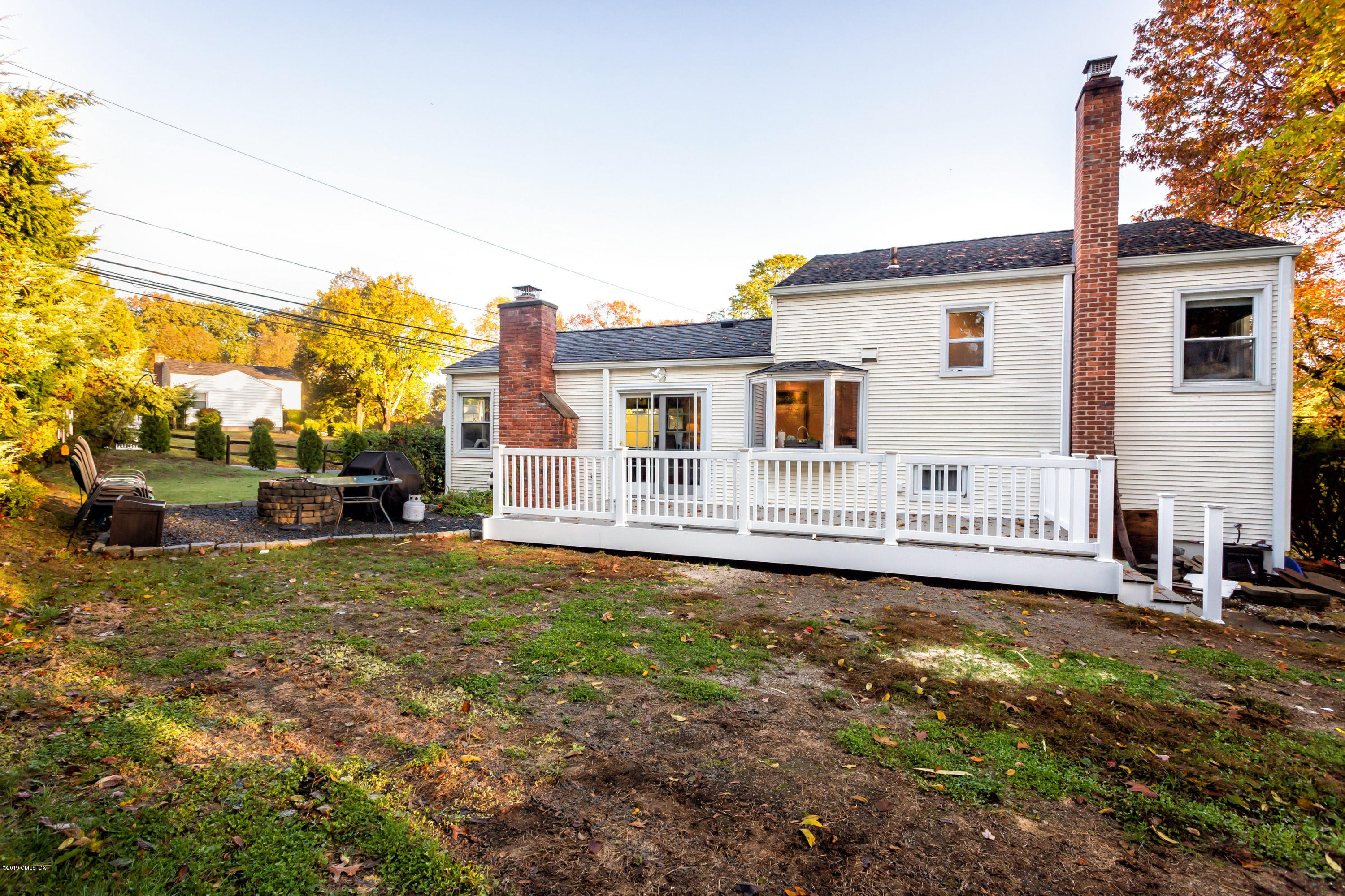 12 Mary Lane Riverside, CT 06878 - Photo 20 of 25 a view of a house with backyard and sitting area